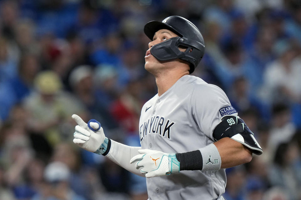 New York Yankees' Aaron Judge (99) celebrates his two-run home run against the Toronto Blue Jays during the fourth inning of a baseball game Wednesday, Sept. 27, 2023, in Toronto. (Frank Gunn/The Canadian Press via AP)