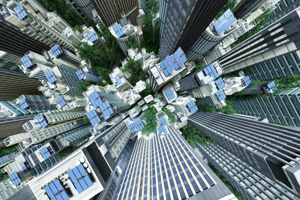 Digital generated image of futuristic sustainable cityscape from top with solar panels on the rooftops of skyscrapers.