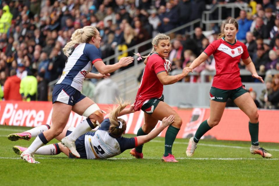 CHALLENGE: Lowri Norkett-Morgan in action for Wales against England (Picture: SWpix) <i>(Image: Picture: SWpix)</i>