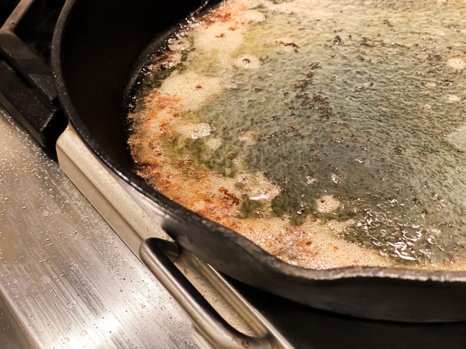 Cast iron frying pan with leftover bacon grease.