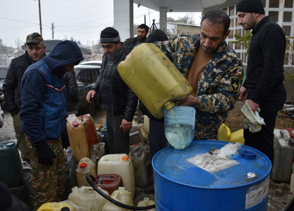 A vendor sells gasoline in the town of Lachin on November 29, 2020, after six weeks of fighting between Armenia and Azerbaijan over the Nagorno-Karabakh region.<span class="copyright">Karen Minasyan—AFP/Getty Images</span>