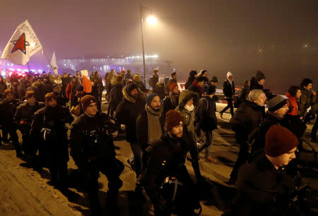 People march during a protest against the new labour law in Budapest, Hungary, December 13, 2018. REUTERS/Bernadett Szabo