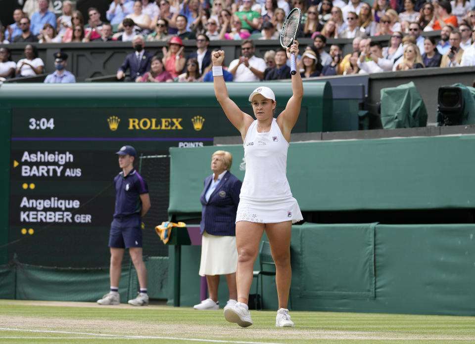 Australia's Ashleigh Barty celebrates after defeating Germany's Angelique Kerber during the women's singles semifinals match on day ten of the Wimbledon Tennis Championships in London, Thursday, July 8, 2021. (AP Photo/Kirsty Wigglesworth)