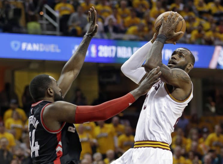 Cleveland Cavaliers’ LeBron James, right, drives to the basket against Toronto Raptors’ Patrick Patterson (54) in the first half in Game 1 of a second-round NBA basketball playoff series,, Monday, May 1, 2017, in Cleveland. (AP Photo/Tony Dejak)