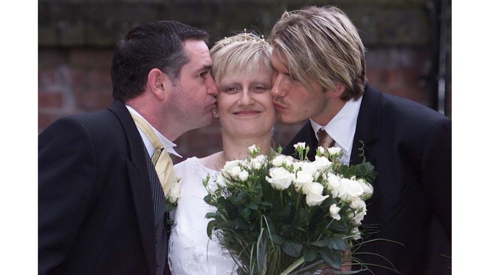 Lynne Beckham being kissed on the cheek by David Beckham on her wedding day