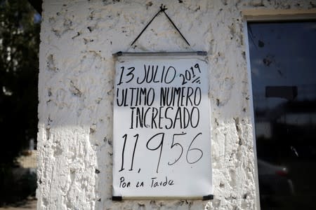 A board with the number of migrants that are requesting asylum is pictured at the premises of the state migrant assistance office in Ciudad Juarez