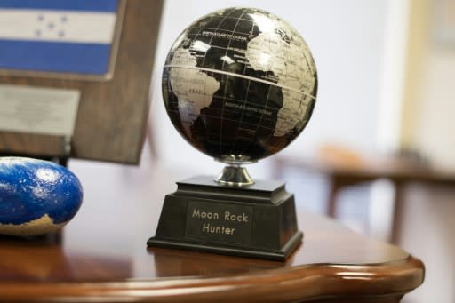 The base of a globe bears the 'Moon Rock Hunter' nickname of Joseph Gutheinz Jr, a retired NASA special agent who tracks down missing Apollo moon rocks