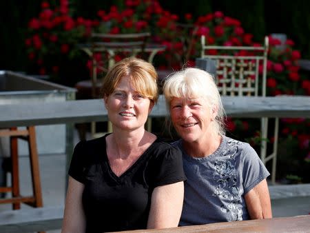 Kristin Bane, left, who runs Schoolhouse Grill restaurant on Harsens Island, and Nancy Bryson, whose family runs the Harsens Island ferry service in Algonac. REUTERS/Jeff Kowalsky