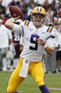 LSU quarterback Joe Burrow (9) passes for a first down against Mississippi State during the first half of their NCAA college football game in Starkville, Miss., Saturday, Oct. 19, 2019. In addition to LSU winning 36-13, Burrow threw four touchdowns to break the LSU season record with 29. (AP Photo/Rogelio V. Solis)