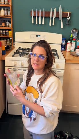 <p>Drew Barrymore/TikTok</p> Drew Barrymore in her kitchen