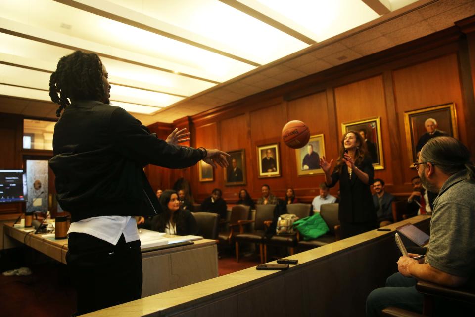 Ja Morant and Joshua Holloway’s attorney, Rebecca Adelman, use a basketball to demonstrate how “checking up” looks during a pick up basketball game during his hearing about his involvement in an incident at his dad’s home on Monday December 11, 2023 at Shelby County Circuit Court in Memphis,Tenn.