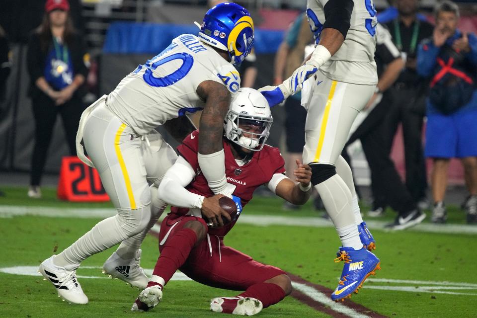 Los Angeles Rams outside linebacker Von Miller (40) tackles Arizona Cardinals quarterback Kyler Murray during the first half of an NFL football game Monday, Dec. 13, 2021, in Glendale, Ariz. (AP Photo/Rick Scuteri)