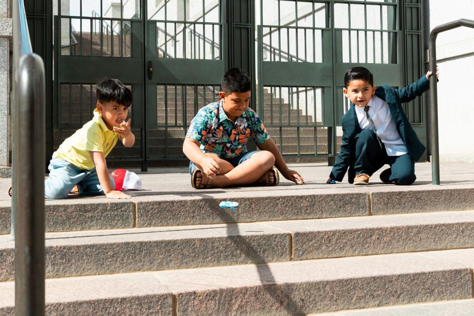 Left to right, Theodore Setu, Sol Setu and Raphy Diaz play with toy cars in between the Sunday morning and Sunday afternoon sessions of the 193rd Semiannual General Conference of The Church of Jesus Christ of Latter-day Saints at the Conference Center in Salt Lake City on Sunday, Oct. 1, 2023. | Megan Nielsen, Deseret News