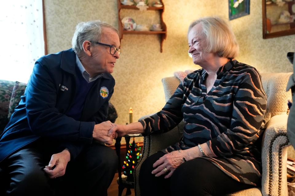 Ohio Gov. Mike DeWine chats with East Palestine resident Carolyn Brown, 79, in her home. As work continues to clean up the vinyl chloride chemical spill from the Norfolk Southern train derailment on Feb. 3, government officials stopped by several residents’ homes.