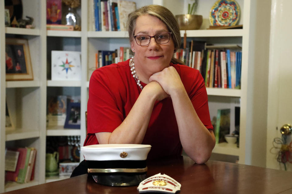 In this Sept. 26, 2019, photo, former Byron, Ga., fire chief Rachel Mosby poses for a photo in the home of a friend in Atlanta. Mosby is a transgender woman who held the job for more than a decade as a man, then was fired in June, 18 months after she openly transitioned. (AP Photo/John Bazemore)