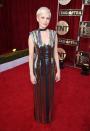 <p>The <em>Manchester by the Sea</em> actress looked very rock and roll in a striped dress from Louis Vuitton. (Photo: Getty Images) </p>