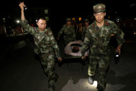 <p>Chinese paramilitary police carry a survivor after an earthquake in Jiuzhaigou county, Ngawa prefecture, Sichuan province, China, Aug. 8, 2017. (Photo China Daily via Reuters) </p>