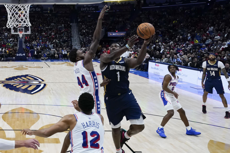 New Orleans Pelicans forward Zion Williamson (1) goes to the basket against Philadelphia 76ers forward Paul Reed (44) in the second half of an NBA basketball game in New Orleans, Wednesday, Nov. 29, 2023. The Pelicans won 124-114. (AP Photo/Gerald Herbert)