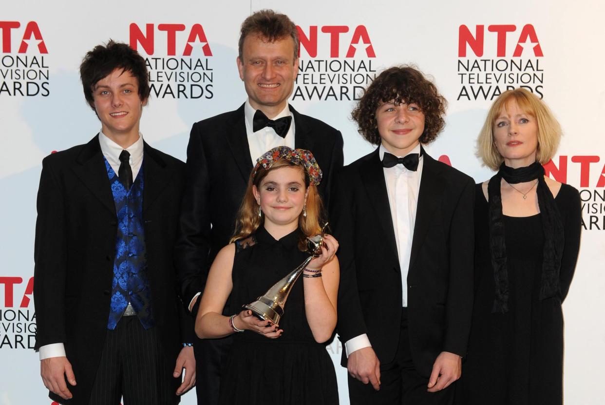 The cast of Outnumbered Tyger Drew-Honey, Hugh Dennis, Ramona Marquez, Daniel Roche and Claire Skinner with their award for Situation Comedy, backstage at the National Television Awards 2012 at the Greenwich Arena London.
