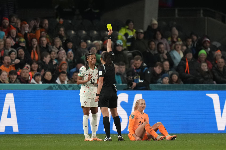 Portugal's Jessica Silva, left, reacts after receiving a yellow card during the second half of the FIFA Women's World Cup Group E soccer match between the Netherlands and Portugal in Dunedin, New Zealand, Sunday, July 23, 2023. (AP Photo/Alessandra Tarantino)