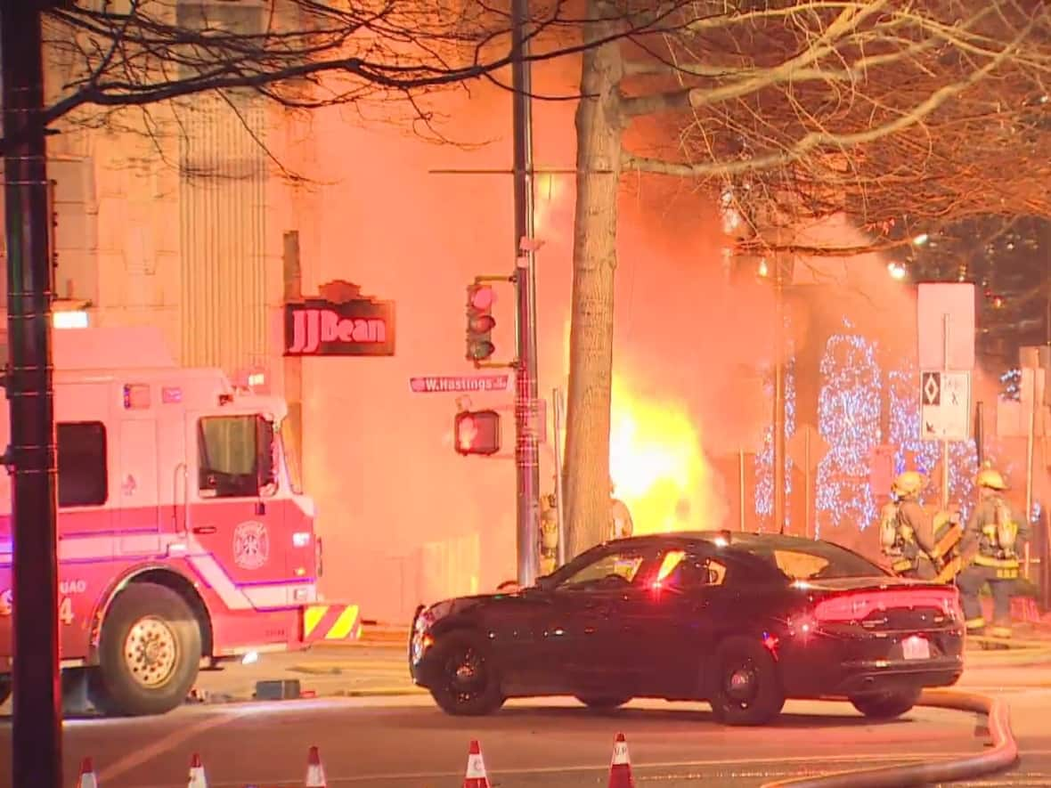 Smoke fills the air near Burrard and West Hastings streets as emergency crews respond to a fire caused by an electrical explosion in downtown Vancouver on Friday. (Nick Allan/CBC - image credit)