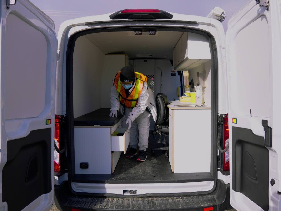 A worker is seen at a mobile overdose service van in Abbotsford, B.C. The service aims to meet people who use drugs where they are. (Fraser Health - image credit)