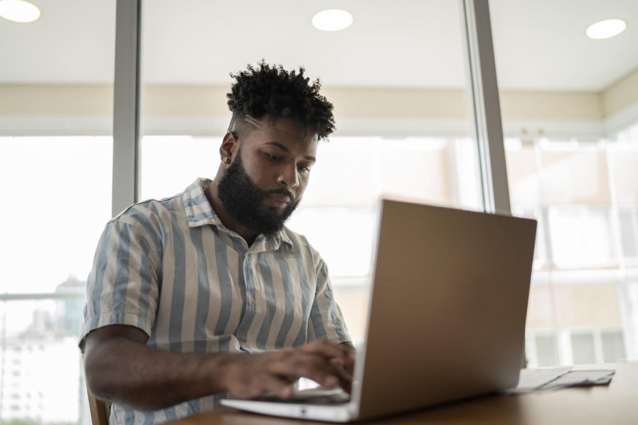 Young man working at home