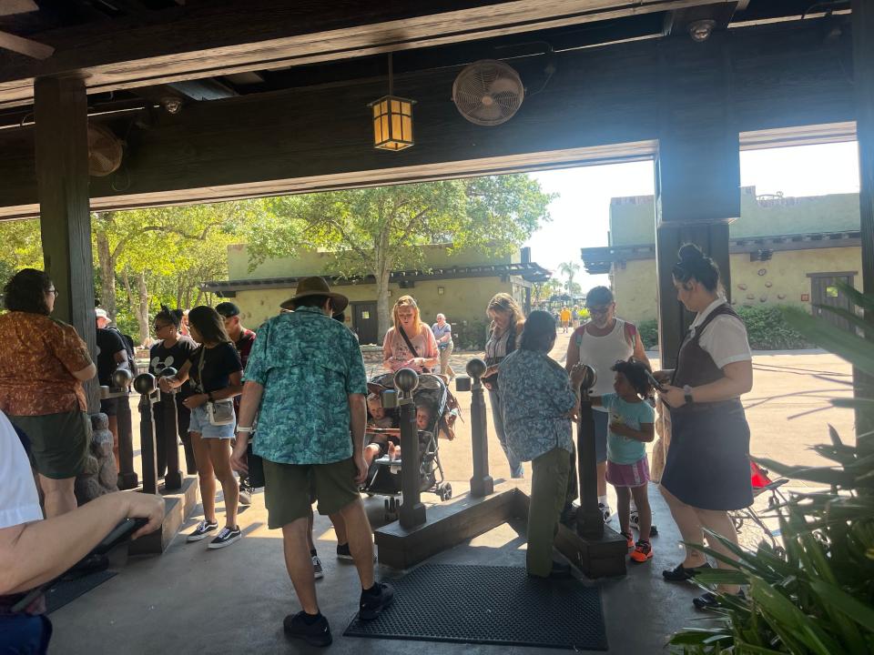 park employees scanning tickets at the entrance to animal kingdom