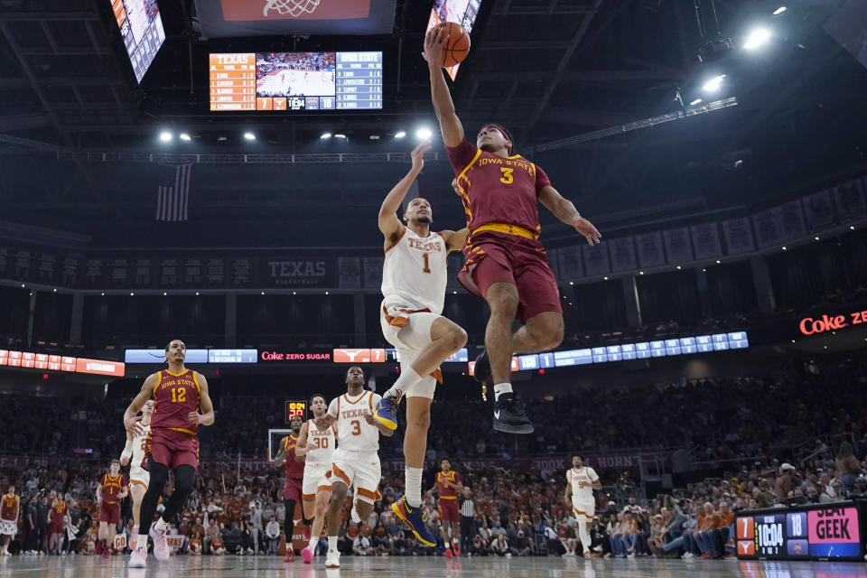 Iowa State guard Tamin Lipsey (3) drives to the basket past Texas forward Dylan Disu (1) during the first half of an NCAA college basketball game Tuesday, Feb. 6, 2024, in Austin, Texas. (AP Photo/Eric Gay)