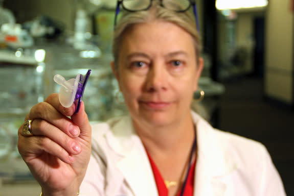 Nurse Harriet Miller shows the pacifier she developed specifically for preemies. Miller was bothered by the fact that most preemies in her care couldn't have pacifiers due to tubes in their mouths that help them breathe and eat. So, she develop