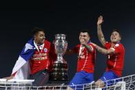 Chile celebrates with the trophy on the goal after defeating Argentina to win the Copa America 2015 final soccer match at the National Stadium in Santiago, Chile, July 4, 2015. REUTERS/Marcos Brindicci