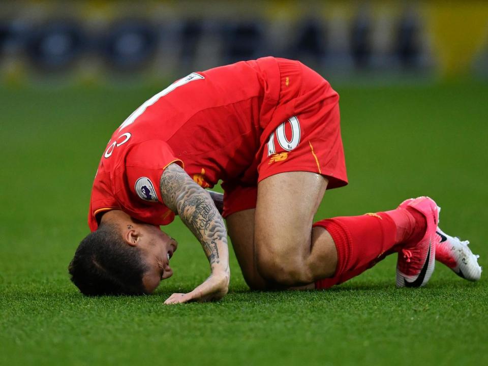 Coutinho reacts after being ran into by Mariappa (Getty)