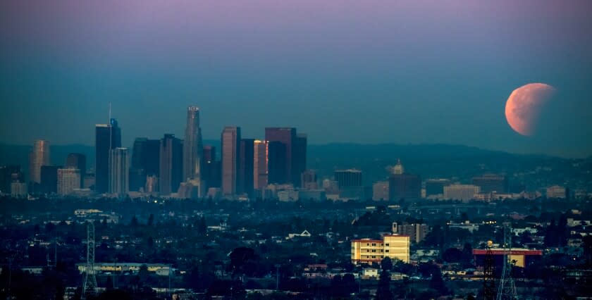 Super Blue Blood Moon sets over downtown Los Angeles