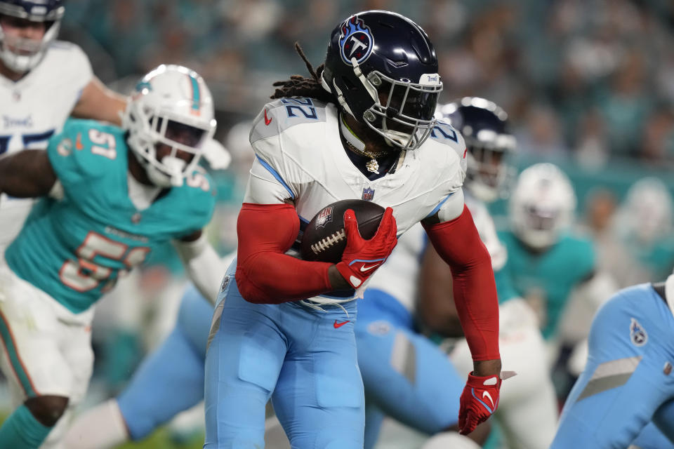 Tennessee Titans running back Derrick Henry (22) runs with the ball during the first half of an NFL football game against the Miami Dolphins, Monday, Dec. 11, 2023, in Miami, Fla. (AP Photo/Lynne Sladky)