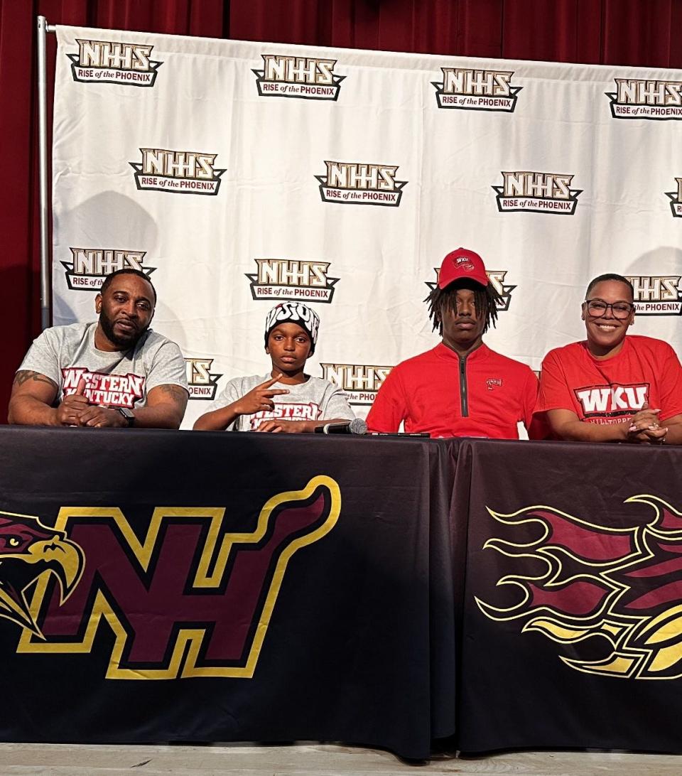New Hampstead's Jaylen Hampton, pictured with his family, at his football signing ceremony with Western Kentucky.