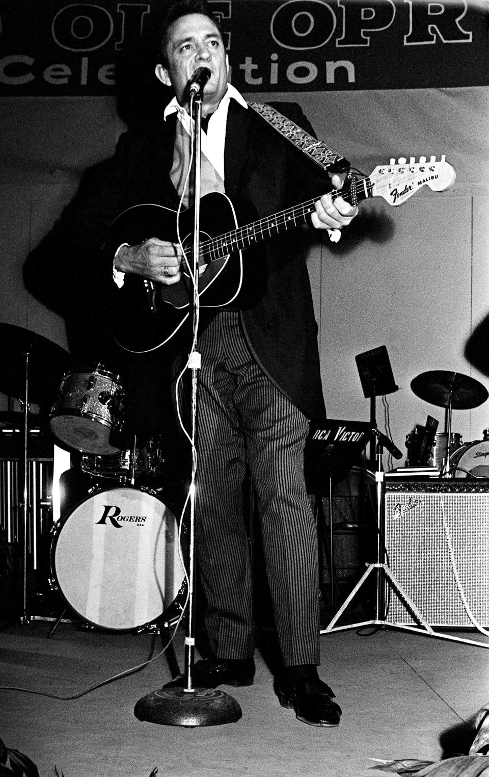 Johnny Cash sang his hit, "Folsom Prision Blues," for the crowd during the Columbia Records luncheon show at Municipal Auditorium on the last day of the 16th annual Country Music D.J. Convention Oct. 19, 1968.