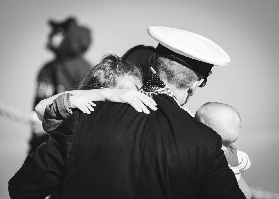 A warm embrace as navy families finally reunite with their loved ones.