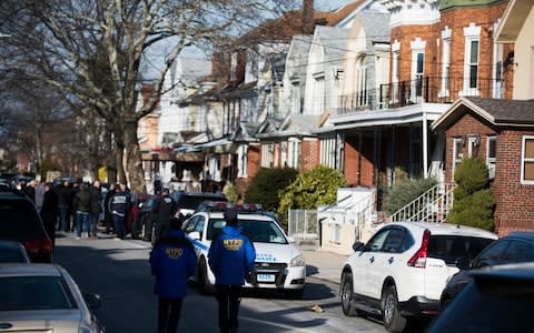 Police block off the street in the Brooklyn borough of New York where officials say Akayed Ullah was living - Credit: AP