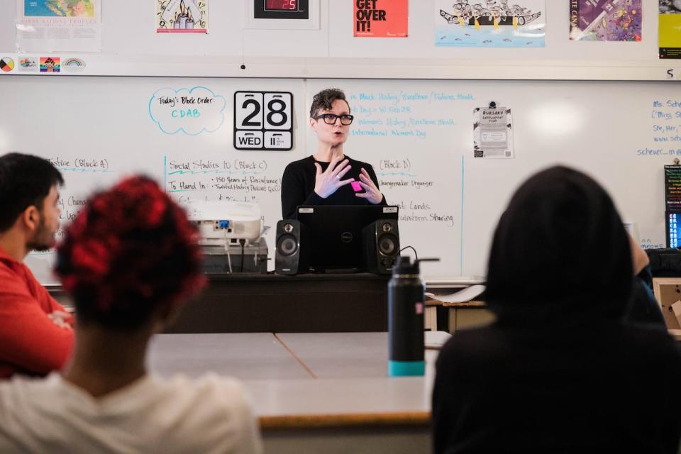 High school teacher Melanie Scheuer speaks to students at Frank Hurt Secondary in Surrey, B.C.