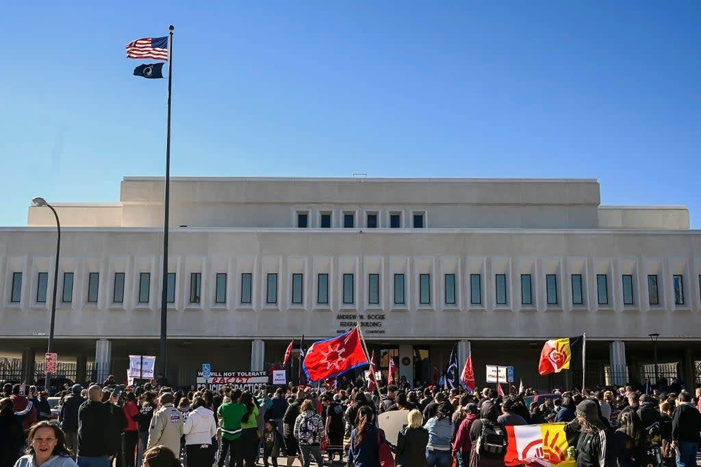 Demonstrators gather outside the Andrew W. Bogue Federal building on Wednesday, March 23, 2022, in Rapid City, where it was announced that a federal civil rights lawsuit was filed against the Grand Gateway Hotel for denying services to Native Americans (ASSOCIATED PRESS)