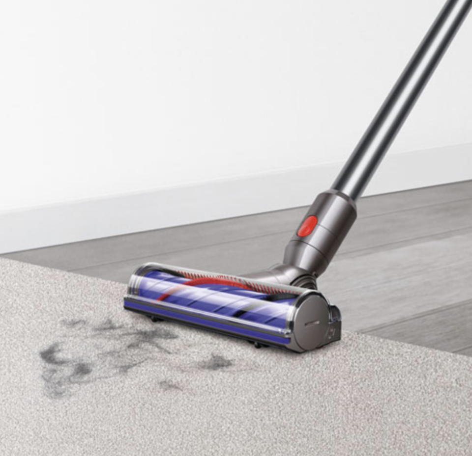 Dyson V8 Animal Cordless Stick Vacuum on carpet and wood floor (Photo via Best Buy)