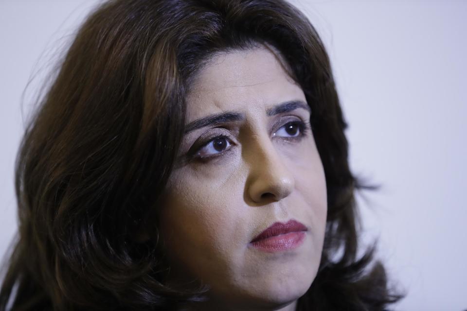 PR agent Francesca Chaouqui is interviewed by The Associated Press about her book 'In the Name of Peter' (Nel Nome di Pietro), a behind-the-scenes drama of a papal reform commission that ended in disgrace after its documents were leaked to two journalists, in Rome, Monday, Feb. 6, 2017. Chaouqui received a suspended sentence for her role in the leaks, and is tempting Vatican prosecutors by publishing confidential documents in her book that hits bookstores Tuesday (AP Photo/Andrew Medichini)