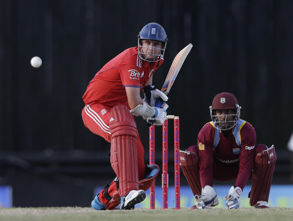 England's captain Stuart Broad, left, bats during the second one-day international cricket match against West Indies at the Sir Vivian Richards Cricket Ground in St. John's, Antigua, Sunday, March 2, 2014. (AP Photo/Ricardo Mazalan)