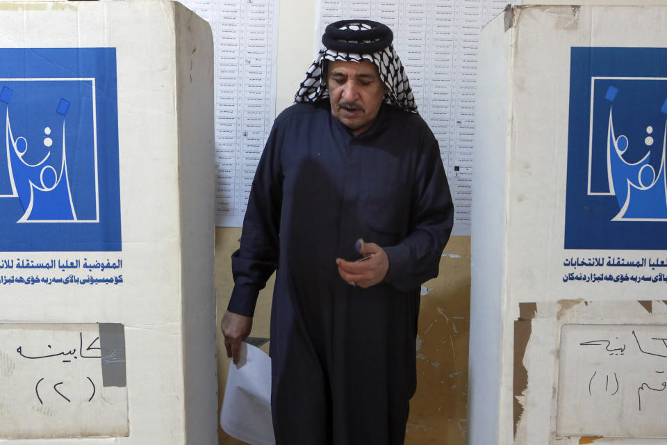 An Iraqi dips his finger to show he voted in the country's provincial elections in Basra, Iraq, Monday, Dec. 18, 2023. (AP Photo/Nabil al-Jurani)