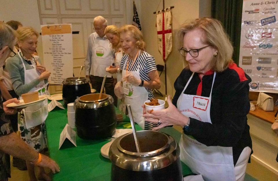 Town of Palm Beach council President Maggie Zeidman prepares a bowl of soup during the 10th Annual Empty Bowls event at the Church of Bethesda-by-the-Sea in February.