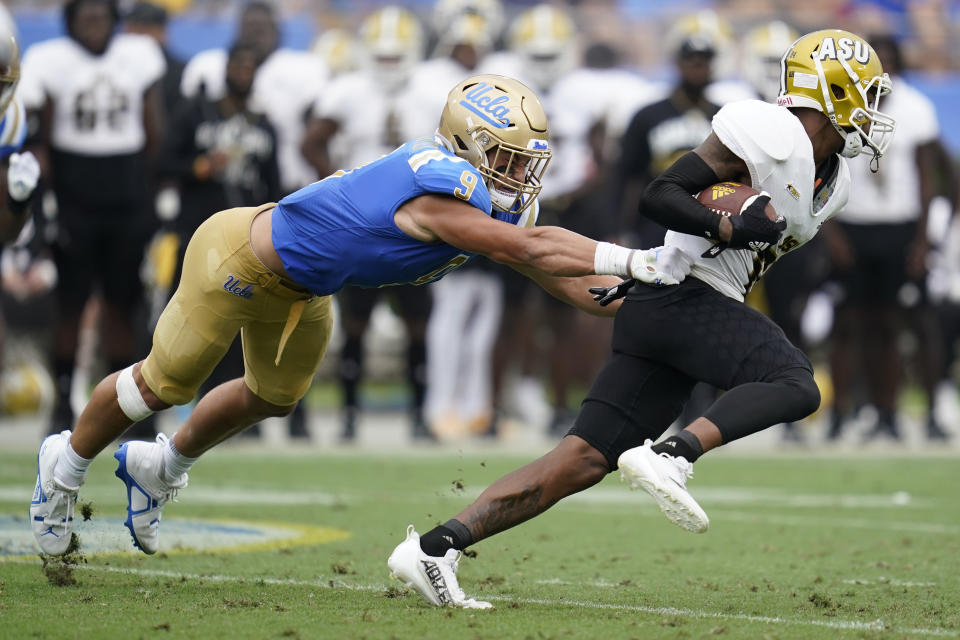 UCLA linebacker Choe Bryant-Strother (9) tackles Alabama State wide receiver Isaiah Scott (84) during the first half of an NCAA college football game in Pasadena, Calif., Saturday, Sept. 10, 2022. (AP Photo/Ashley Landis)