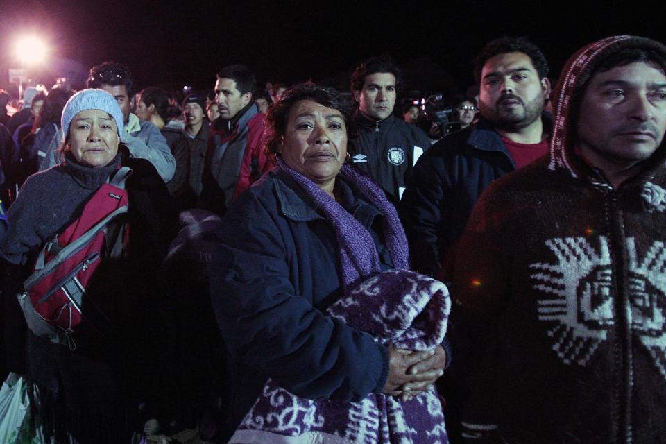 FILE - In this Aug. 7, 2010 file photo, Maria Segovia, the sister of trapped miner Dario Segovia, watches rescue efforts at the camp outside the San Jose mine near Copiapo, Chile. French actress Juliette Binoche will play the part of Segovia in the film “The 33” which dramatizes the cave-in that trapped 33 miners deep below Chile’s Atacama desert for 69 days. Maria Segovia became known for her outgoing personality as "the mayor" of the makeshift settlement that sprang outside the mine. (AP Photo/Luis Hidalgo, File)