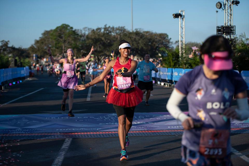 (Feb. 26, 2023) Runners crossed the finish line at the Disney Princess Half Marathon presented by CORKCICLE at Walt Disney World Resort in Lake Buena Vista, Fla., the final event during the four-day race weekend. The women-inspired event featured thousands of runners, plus entertainment and themes geared toward women throughout the weekend. (Elisa White, photographer)