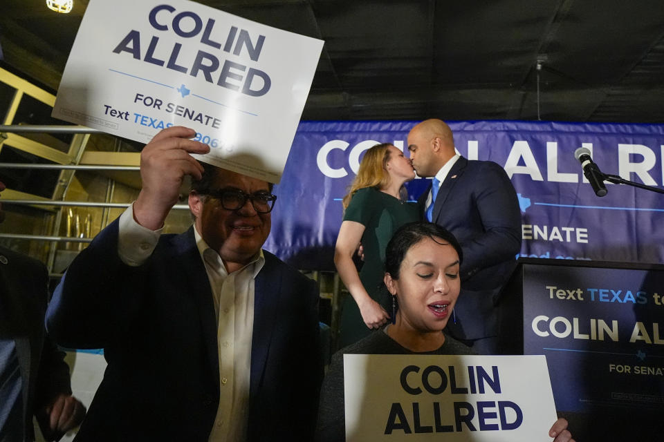 U.S Rep. Colin Allred, D-Texas, top right, a Democratic candidate for U.S. Senate, kisses his wife, Alexandra Eber, during a primary-night gathering, Tuesday, March 5, 2024, in Dallas. (AP Photo/Julio Cortez)