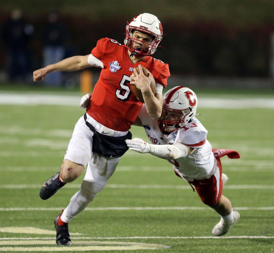 North Central quarterback and Chatham Glenwood graduate Luke Lehnen (5) runs for a touchdown past Cortland defender Luke Winslow (13) during the second half of the Amos Alonzo Stagg Bowl NCAA Division III championship football game in Salem, Va., Friday Dec. 15, 2023. (Matt Gentry/The Roanoke Times via AP)